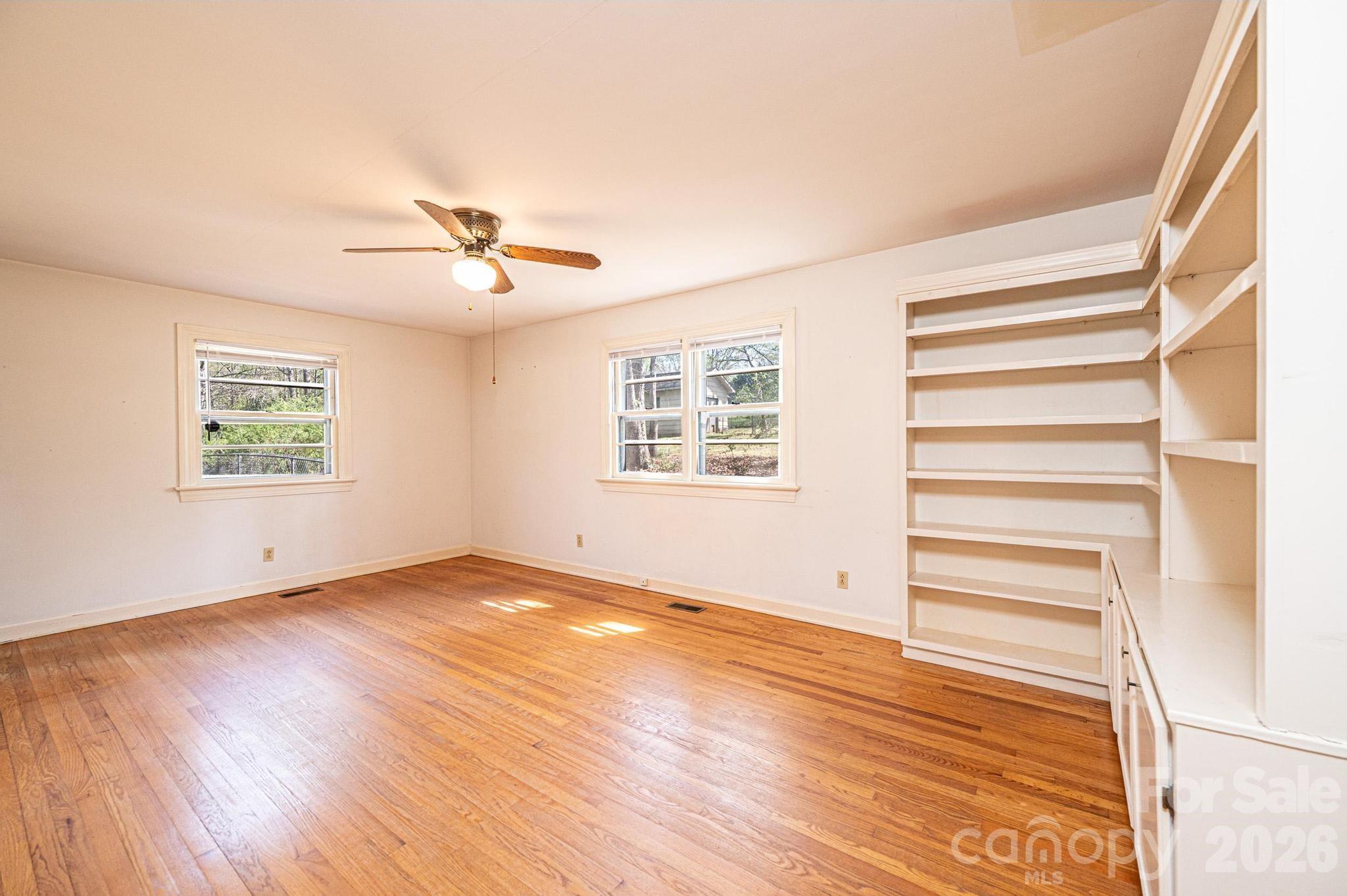 781 23rd Avenue Northeast Hickory, NC 28601 - Photo 26 of 41 wooden floor in an empty room with a window