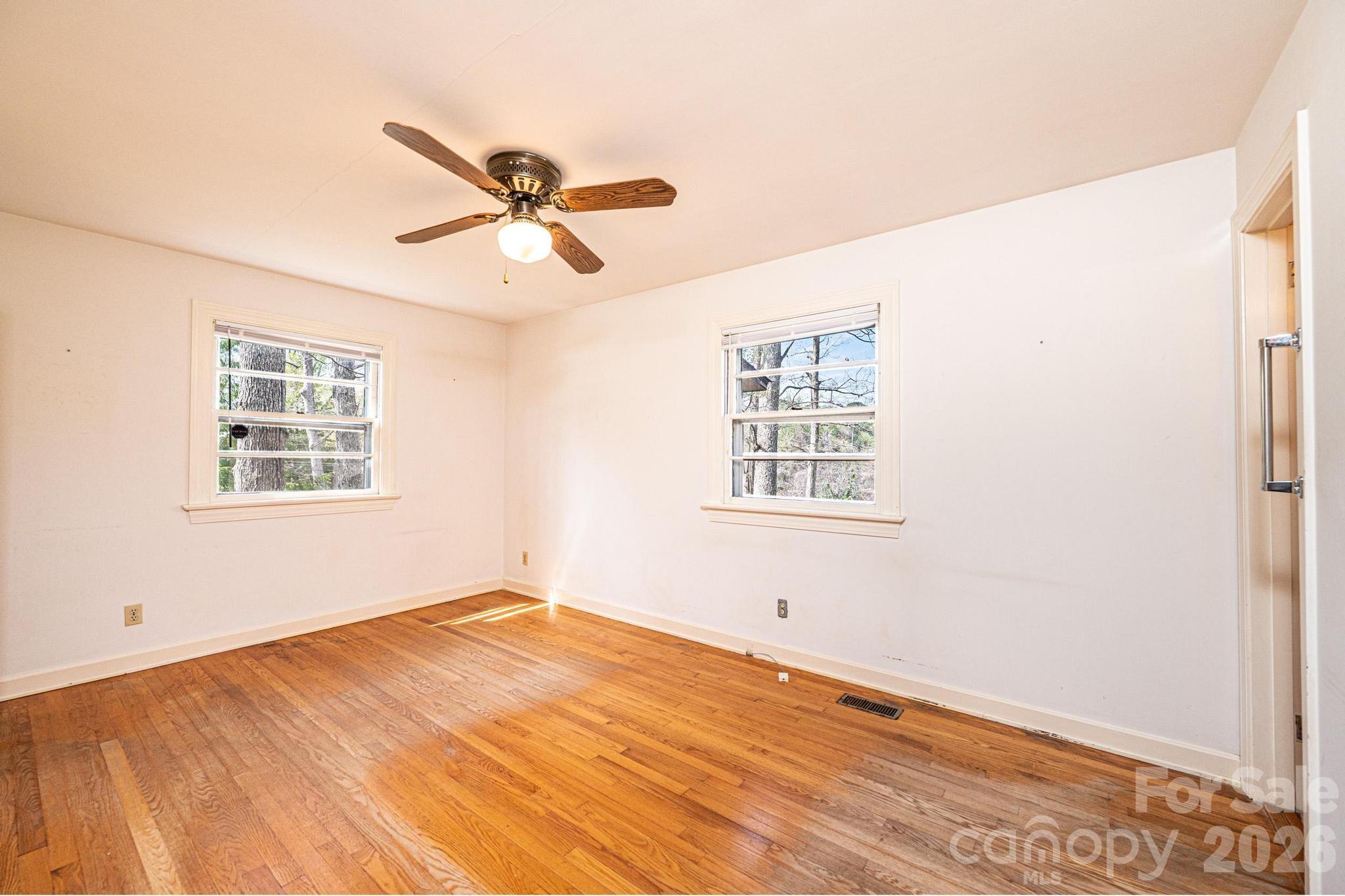 781 23rd Avenue Northeast Hickory, NC 28601 - Photo 29 of 41 a view of a big room with windows and ceiling fan