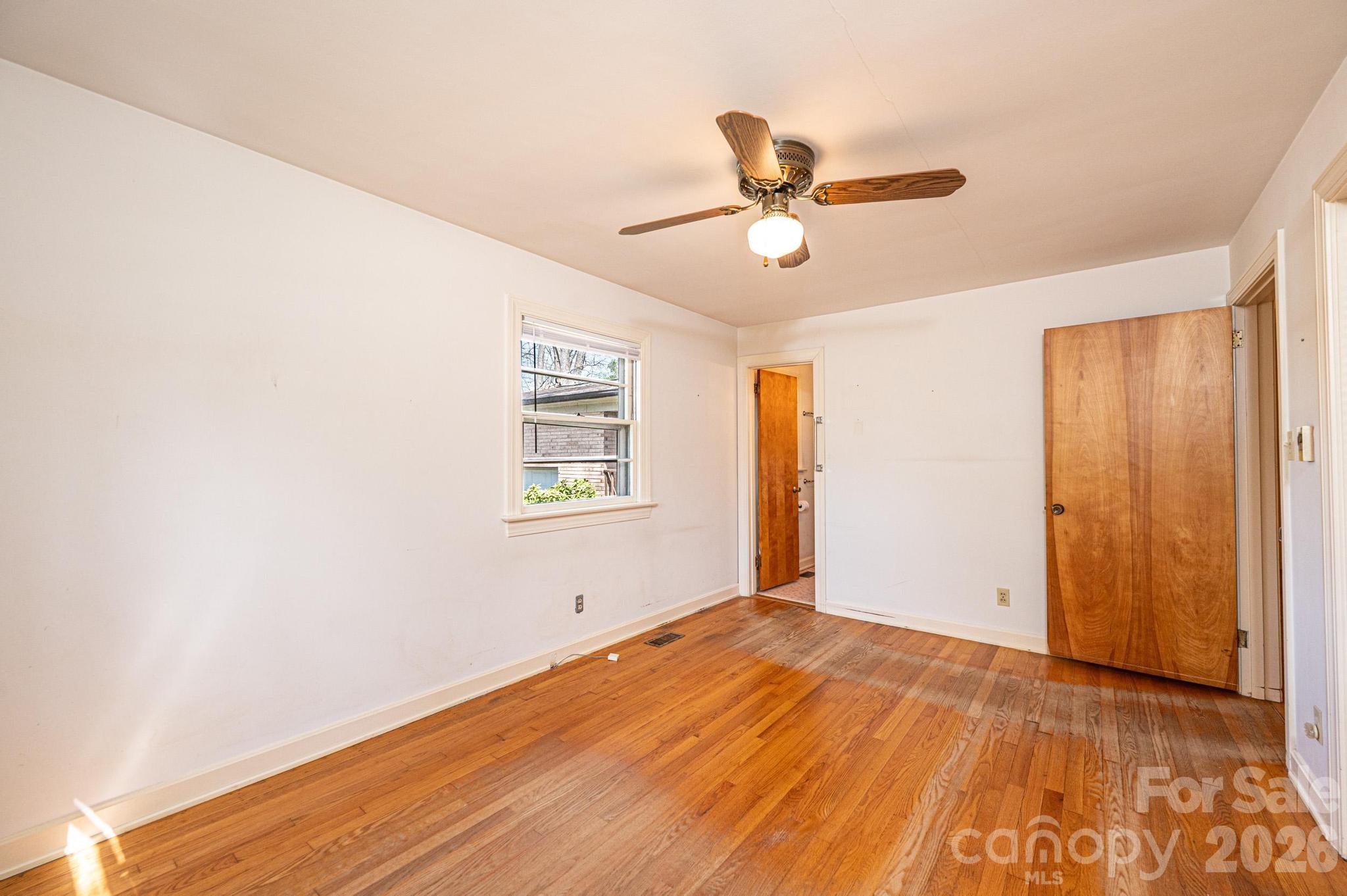 781 23rd Avenue Northeast Hickory, NC 28601 - Photo 36 of 41 a view of empty room with wooden floor and fan