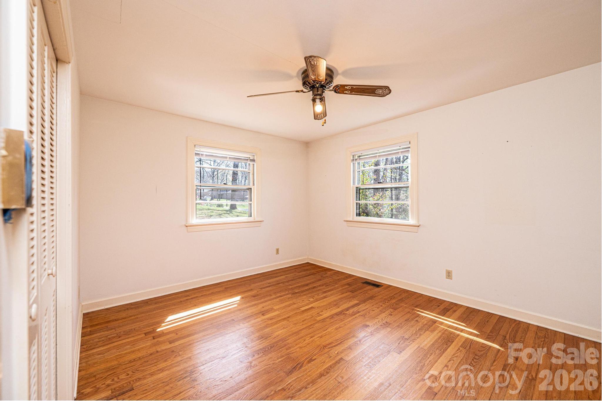 781 23rd Avenue Northeast Hickory, NC 28601 - Photo 37 of 41 a view of an empty room with wooden floor and a window