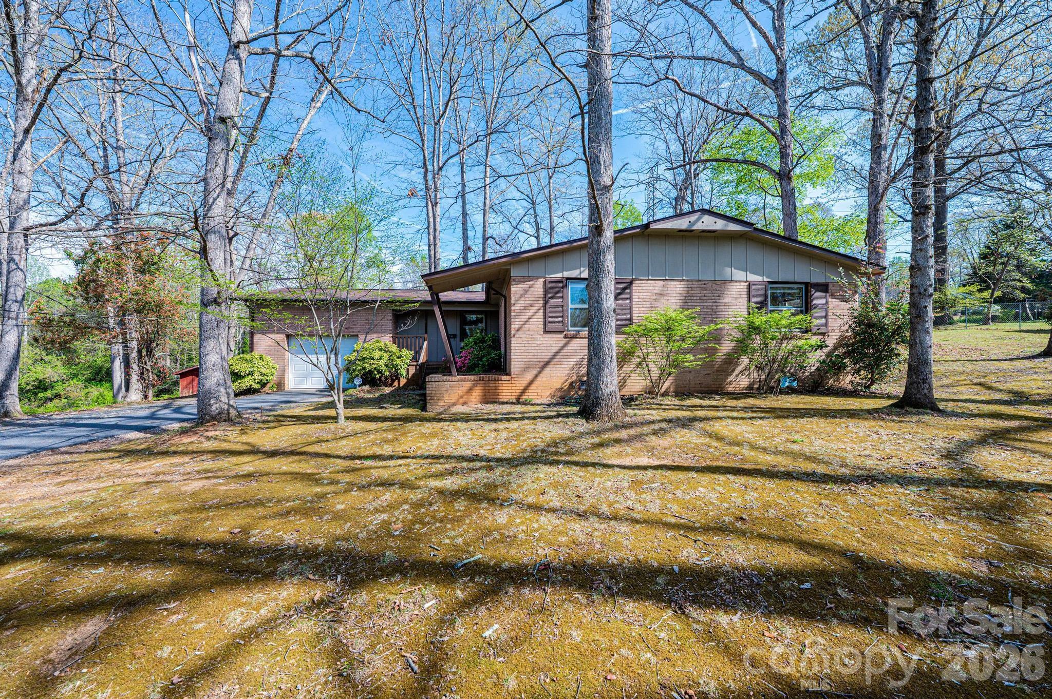 781 23rd Avenue Northeast Hickory, NC 28601 - Photo 4 of 41 a view of a house with a large trees and a yard