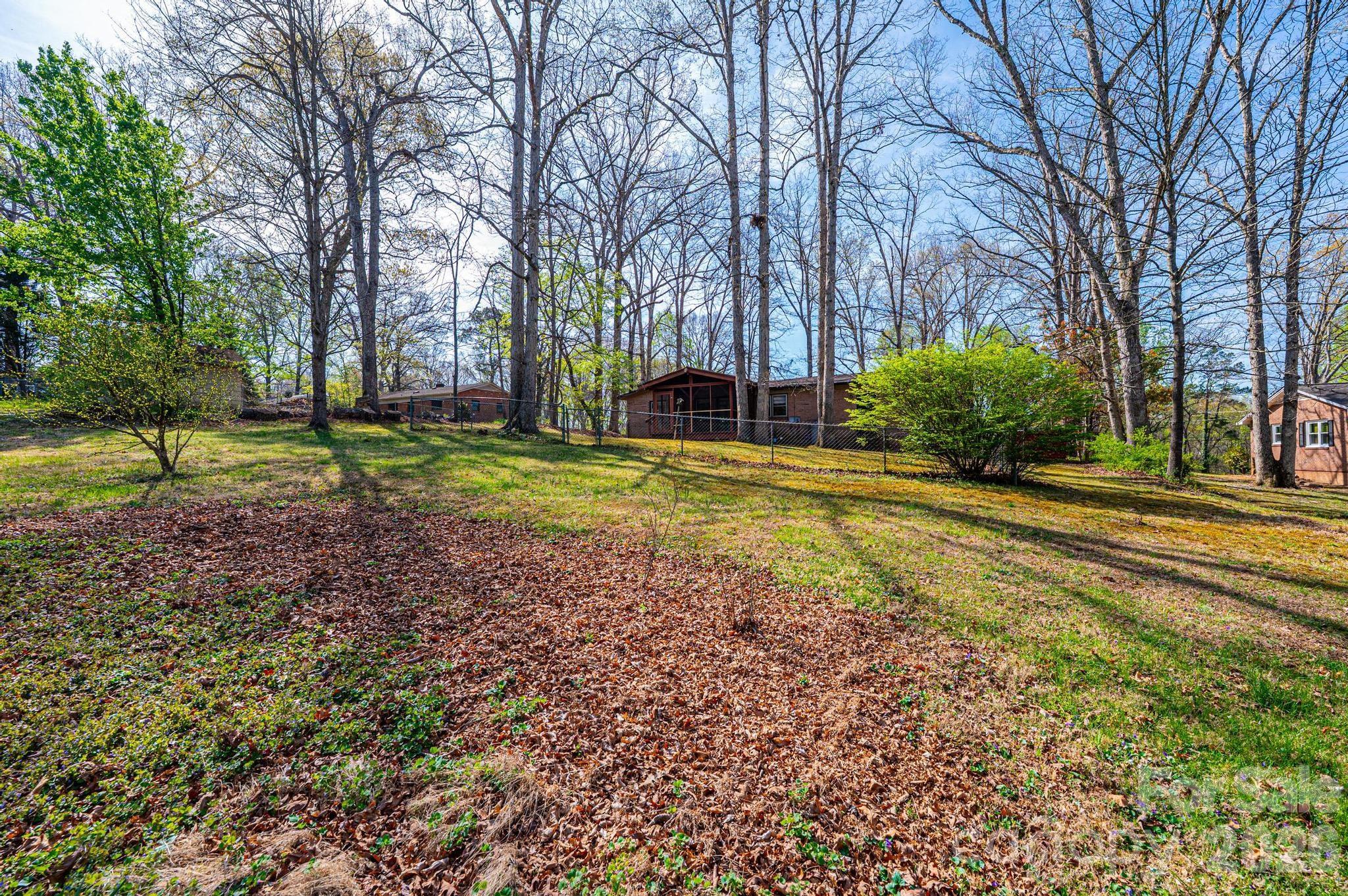 781 23rd Avenue Northeast Hickory, NC 28601 - Photo 10 of 41 a view of a house with a yard and large trees