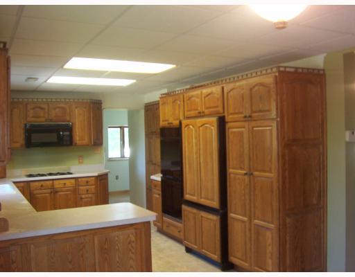 182 Clovis Ridge Road West Finley, PA 15377 - Photo 7 of 18 Kitchen. Upgraded appliances. Two pantries and hidden appliance storage. Corner cuboards equipped with Lazy Susans. Custom designed refrigerator front.