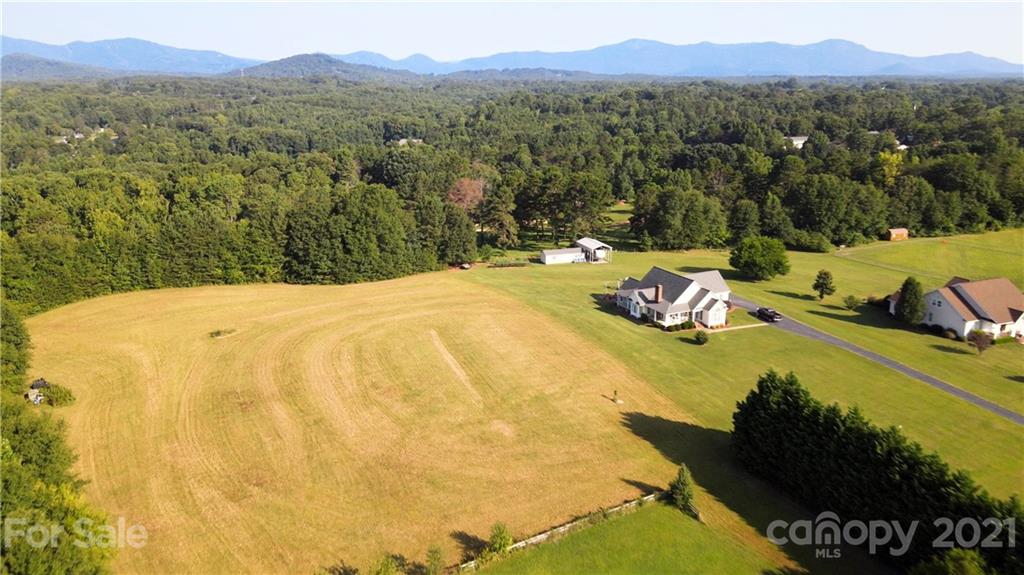 315 Sunset Road, Unit 6 & 7 Landrum, SC 29356 - Photo 7 of 15 a view of a lake with a mountain