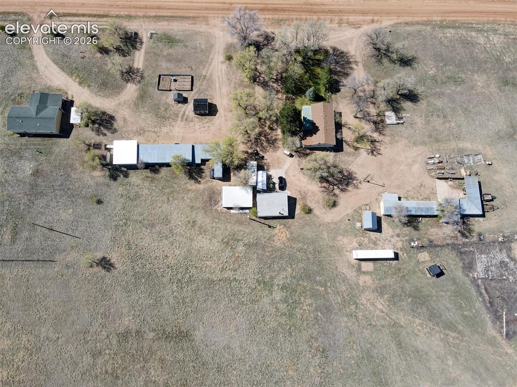 22558 Enoch Road Calhan, CO 80808 - Photo 49 of 50 an aerial view of a houses with outdoor space