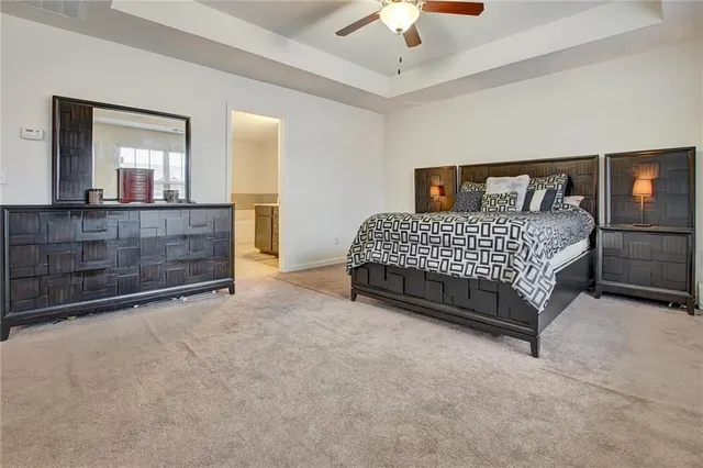 a bedroom with a bed and a tv on table