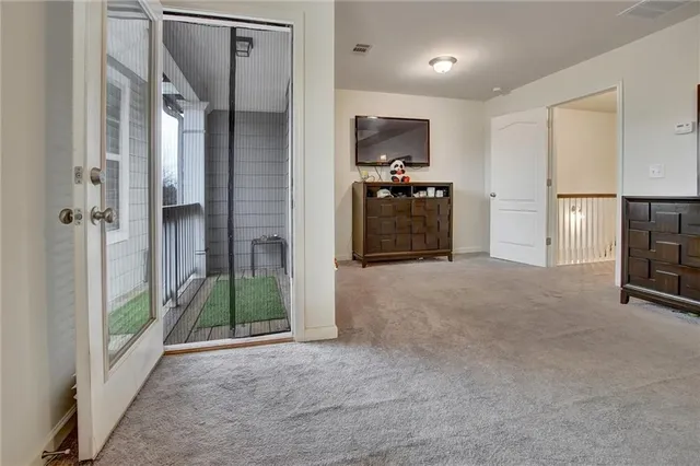 a view of a porch with a small yard