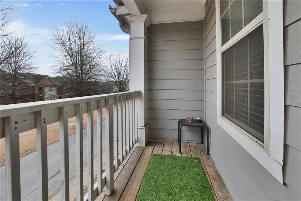 7687 Cabrini Place Fairburn, GA 30213 - Photo 19 of 29 a view of a porch with a small yard
