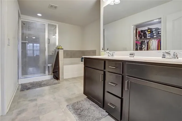 a bathroom with a bathtub and a shower