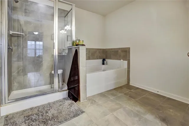 a view of bathroom with a toilet sink and mirror