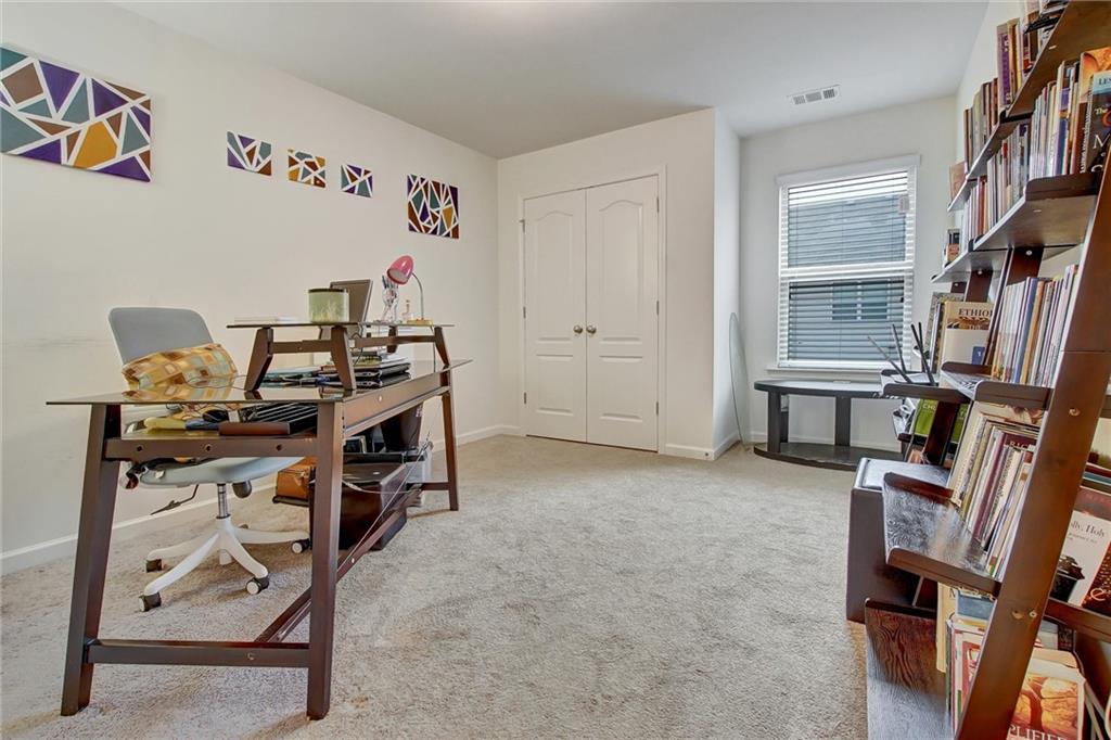 7687 Cabrini Place Fairburn, GA 30213 - Photo 23 of 29 a view of room with workspace
