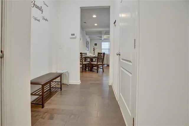 a view of a hallway with seating area