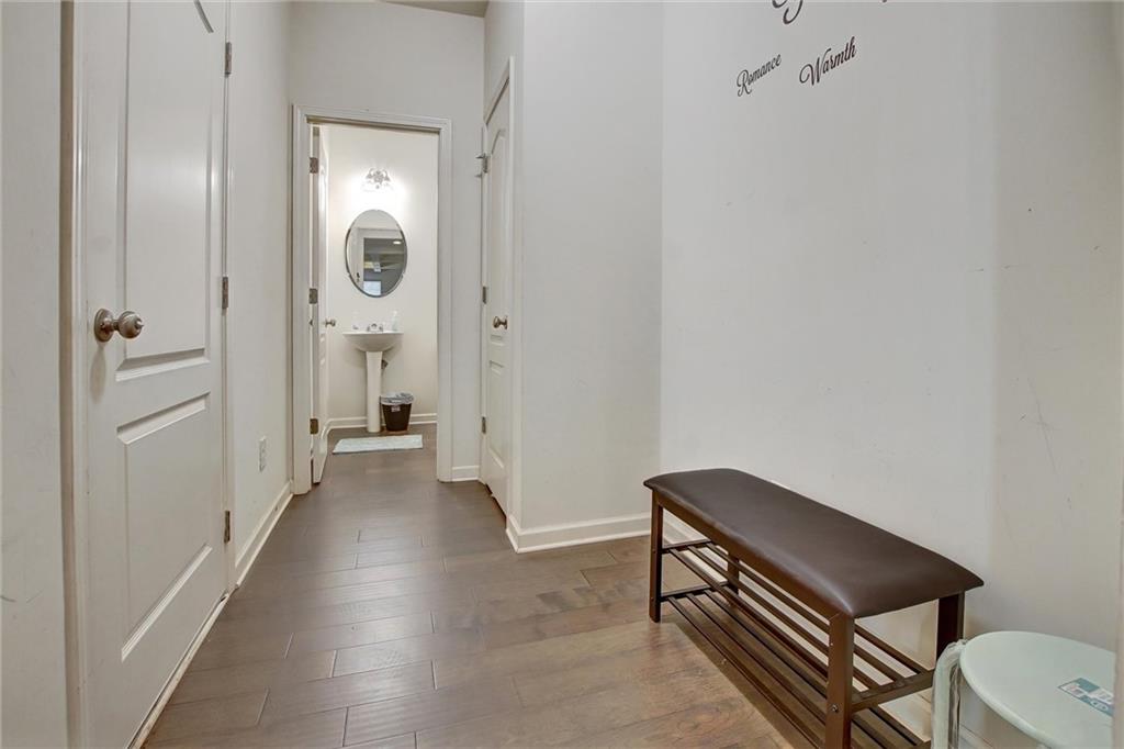 7687 Cabrini Place Fairburn, GA 30213 - Photo 10 of 29 a view of a hallway with seating area