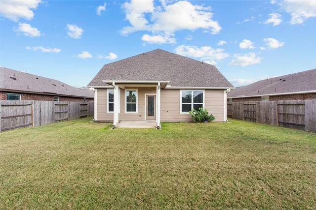 a view of a house with a back yard