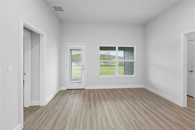 a view of an empty room with a window