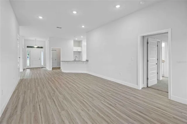 a view of an empty room with a window