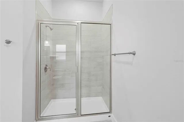 a bathroom with a granite countertop toilet a sink and a bathtub