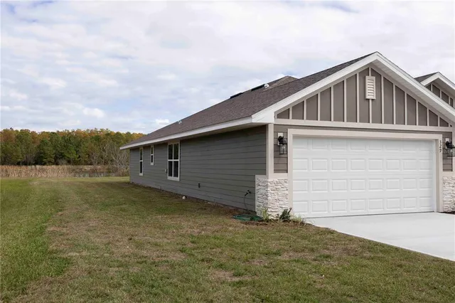 a backyard of a house with lots of green space