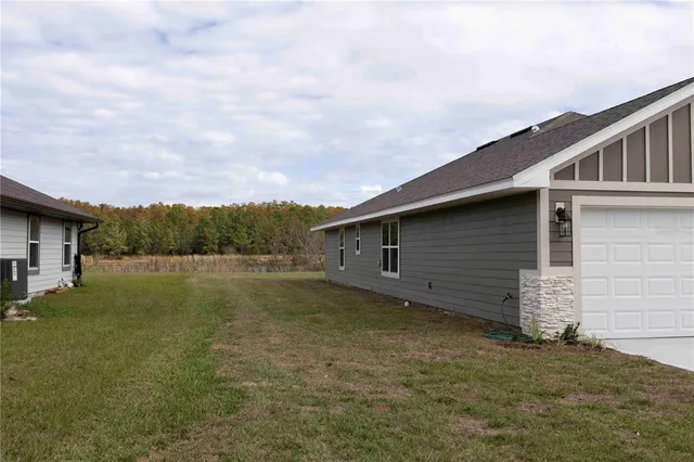 a backyard of a house with lots of green space