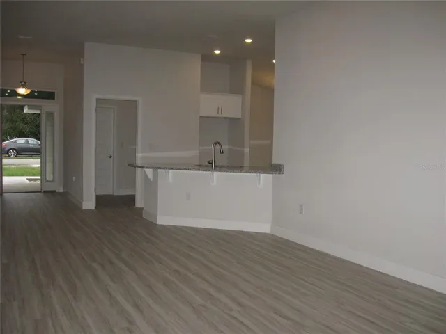 a view of cabinets and wooden floor