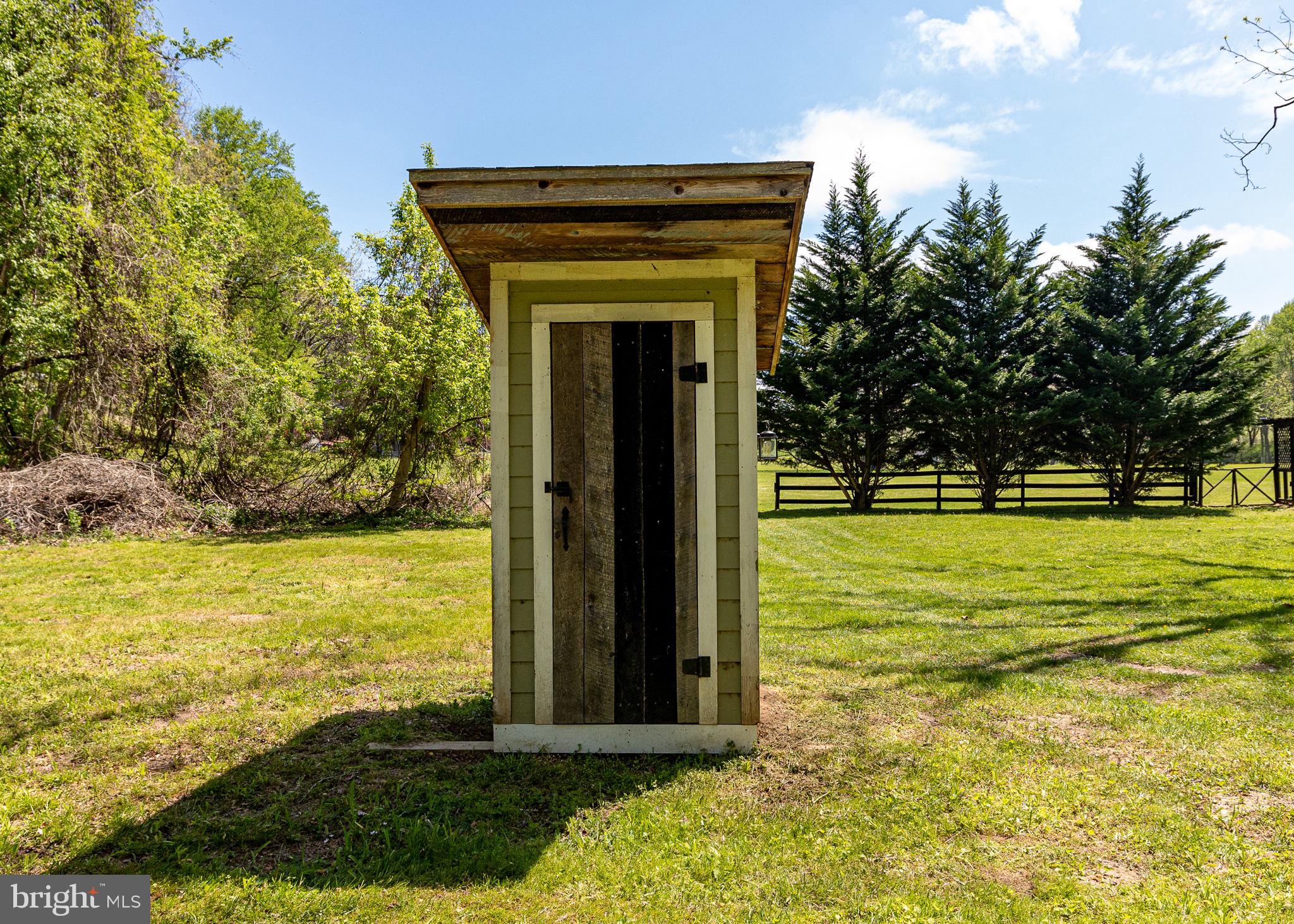 2310 Putnam Road Forest Hill, MD 21050 - Photo 26 of 90 Charming shed in a serene landscape.