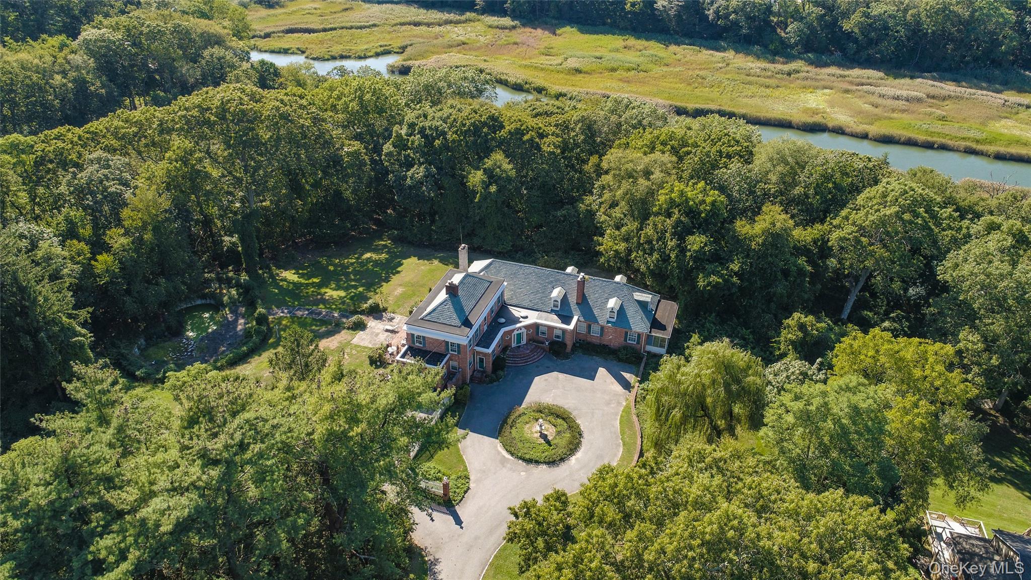 274 River Road St. James, NY 11780 - Photo 28 of 30 a view of a house with a yard and lake view