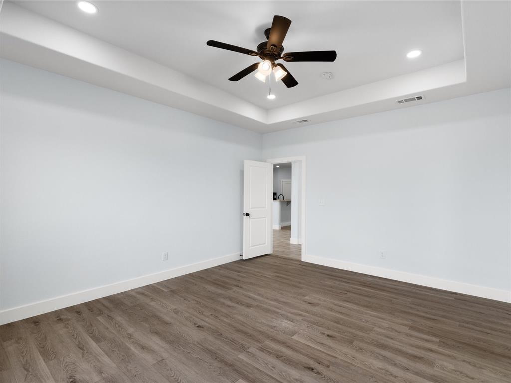 1013 Magnolia Court Springtown, TX 76082 - Photo 23 of 33 wooden floor in an empty room