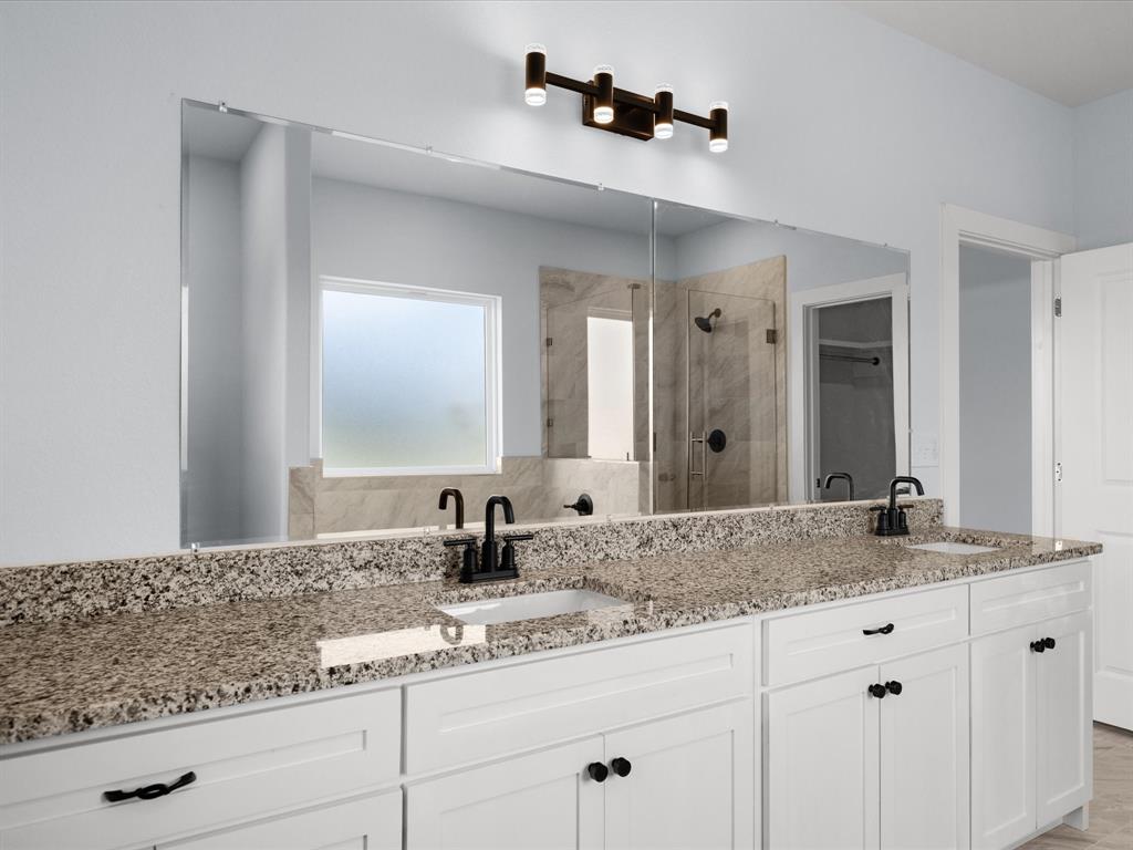 1013 Magnolia Court Springtown, TX 76082 - Photo 24 of 33 a bathroom with a sink and a mirror