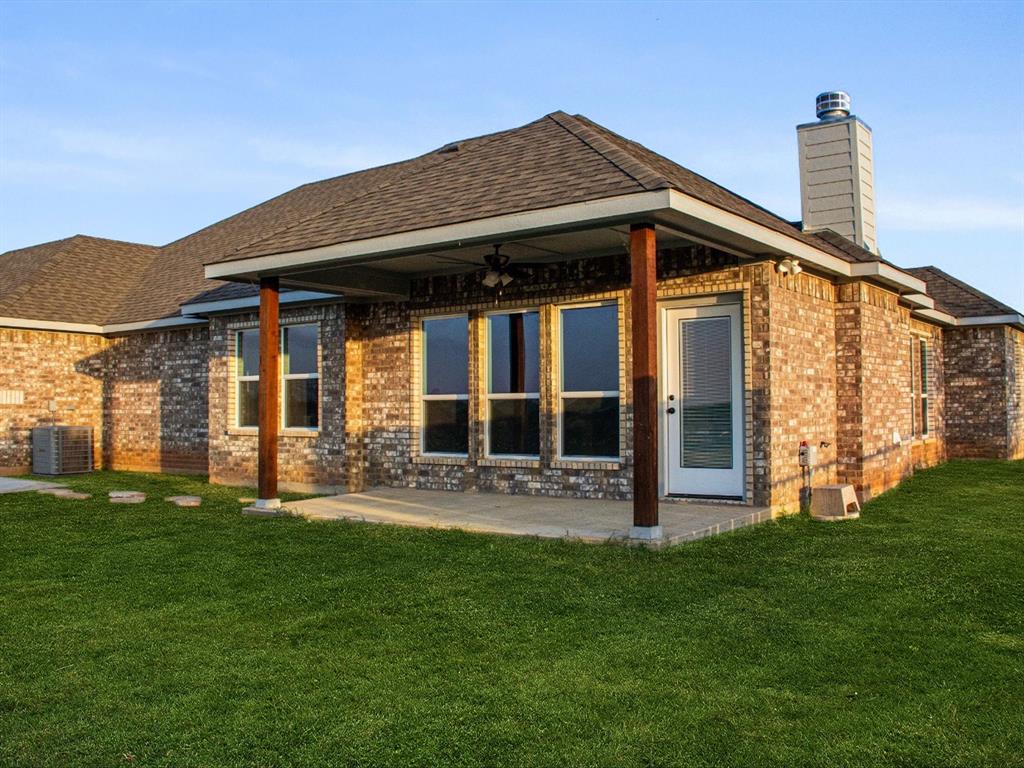 1013 Magnolia Court Springtown, TX 76082 - Photo 29 of 33 a front view of a house with garden