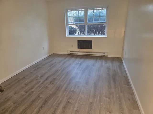 wooden floor and window in a room