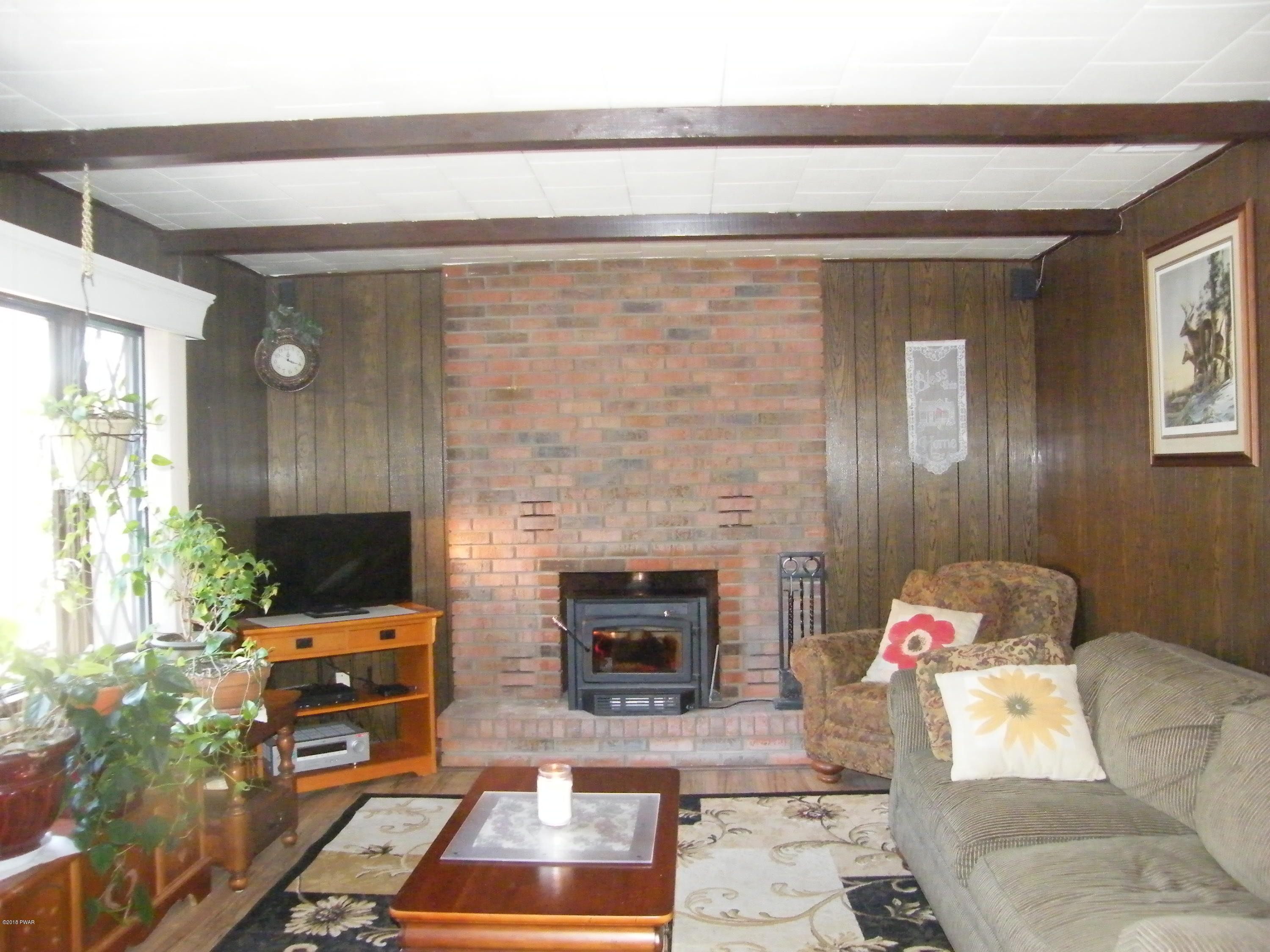 121 Dark Swamp Road Dingmans Ferry, PA 18328 - Photo 8 of 24 Firepalce view of living room