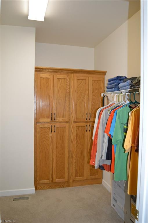 571 Carson Road Pilot Mountain, NC 27041 - Photo 18 of 30 Partial view of master bedroom walk-in closet. Additional hanging space is on the left out of view.
