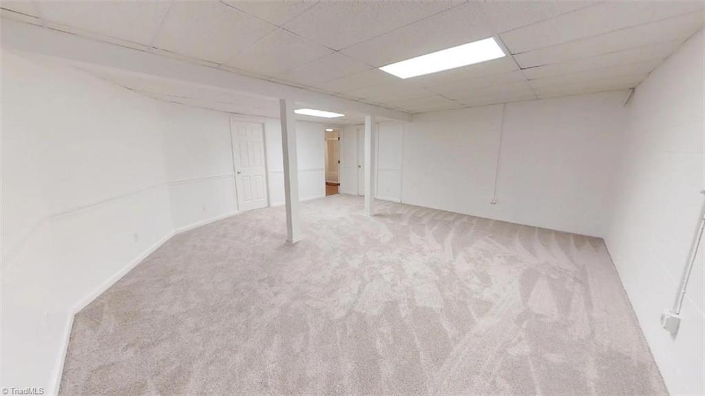 571 Carson Road Pilot Mountain, NC 27041 - Photo 23 of 30 Versatile basement space with a full bath and walk-in closet/storage space. New carpeting just installed.