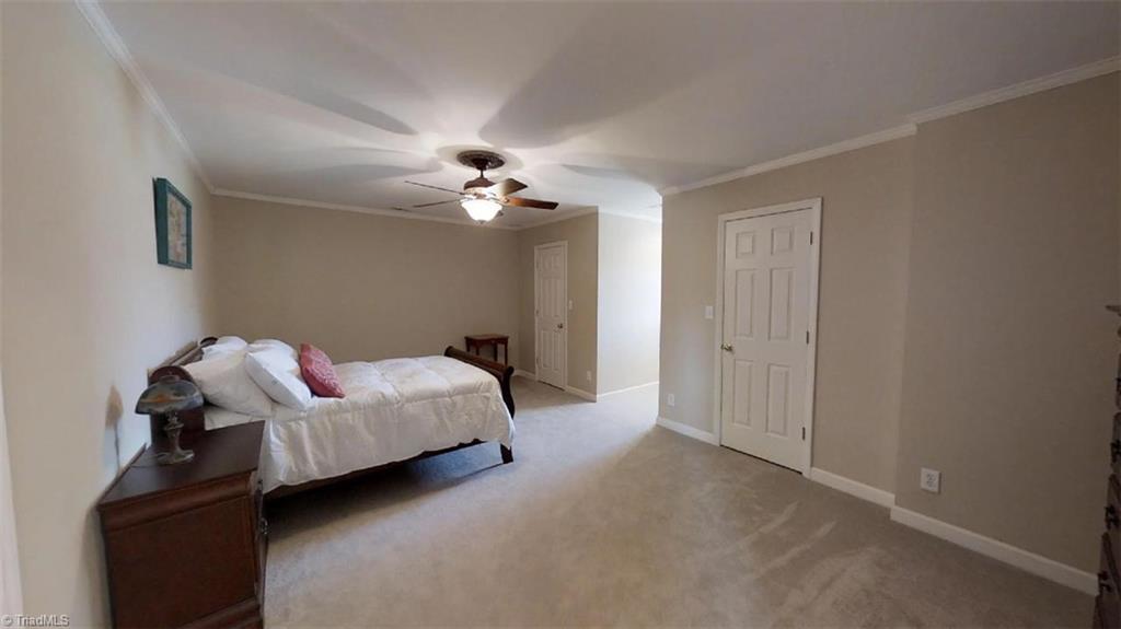 571 Carson Road Pilot Mountain, NC 27041 - Photo 26 of 30 One of two upper level bedroom with great closet space and add'l storage in the floored walk-in eaves.