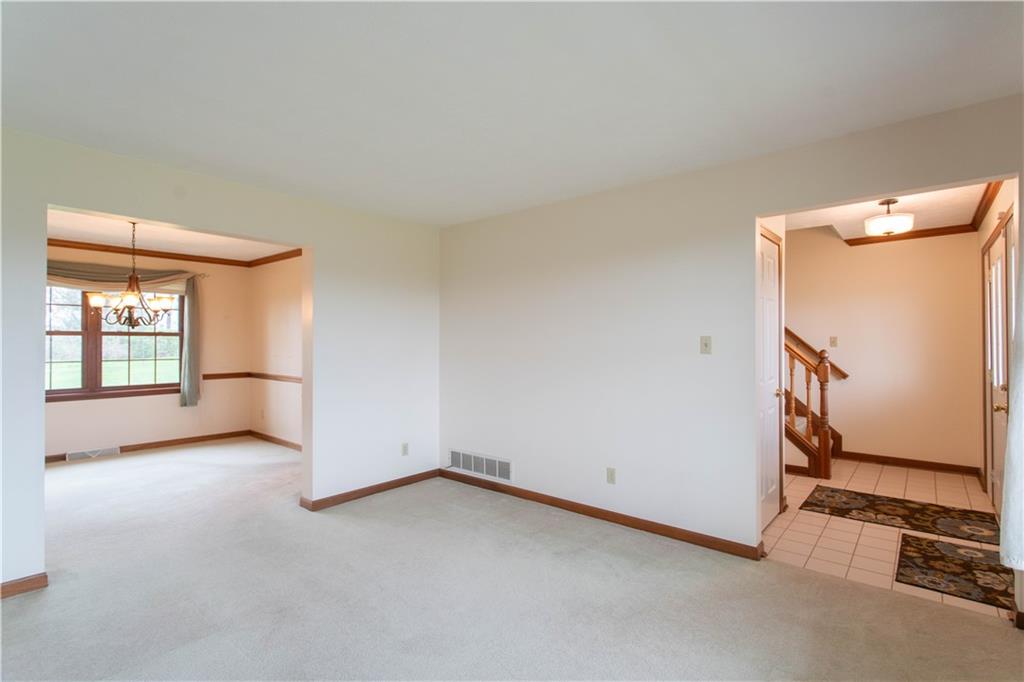 128 Moffett Run Road Aliquippa, PA 15001 - Photo 4 of 48 an empty room with windows