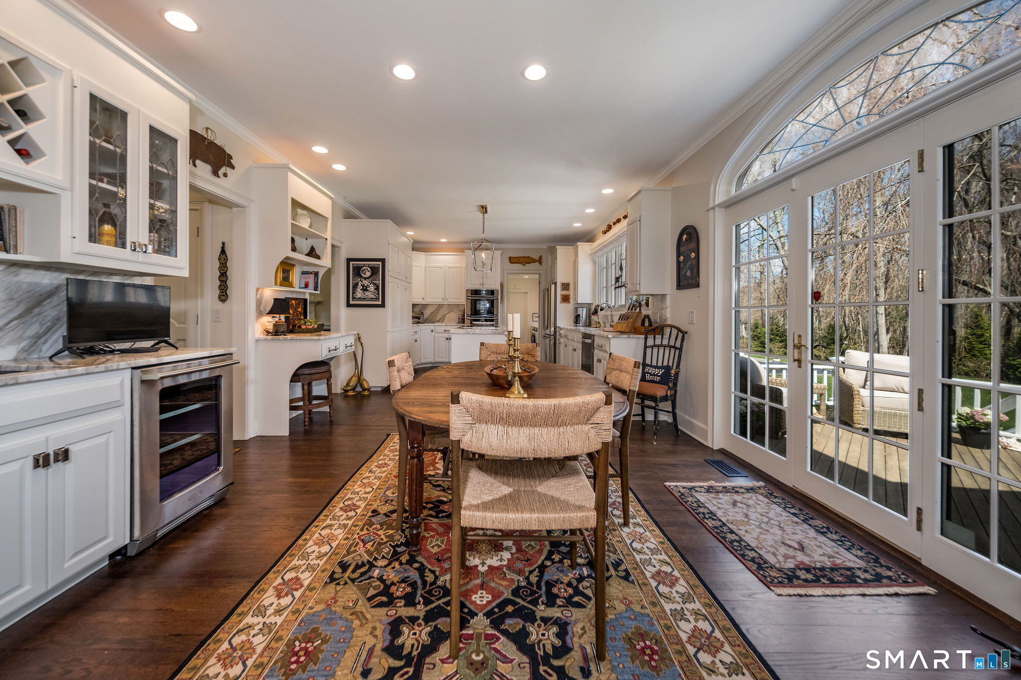 9 Matson Ridge Old Lyme, CT 06371 - Photo 20 of 42 French doors leading out to a spacious deck along with a wine refrigerator and wine bar
