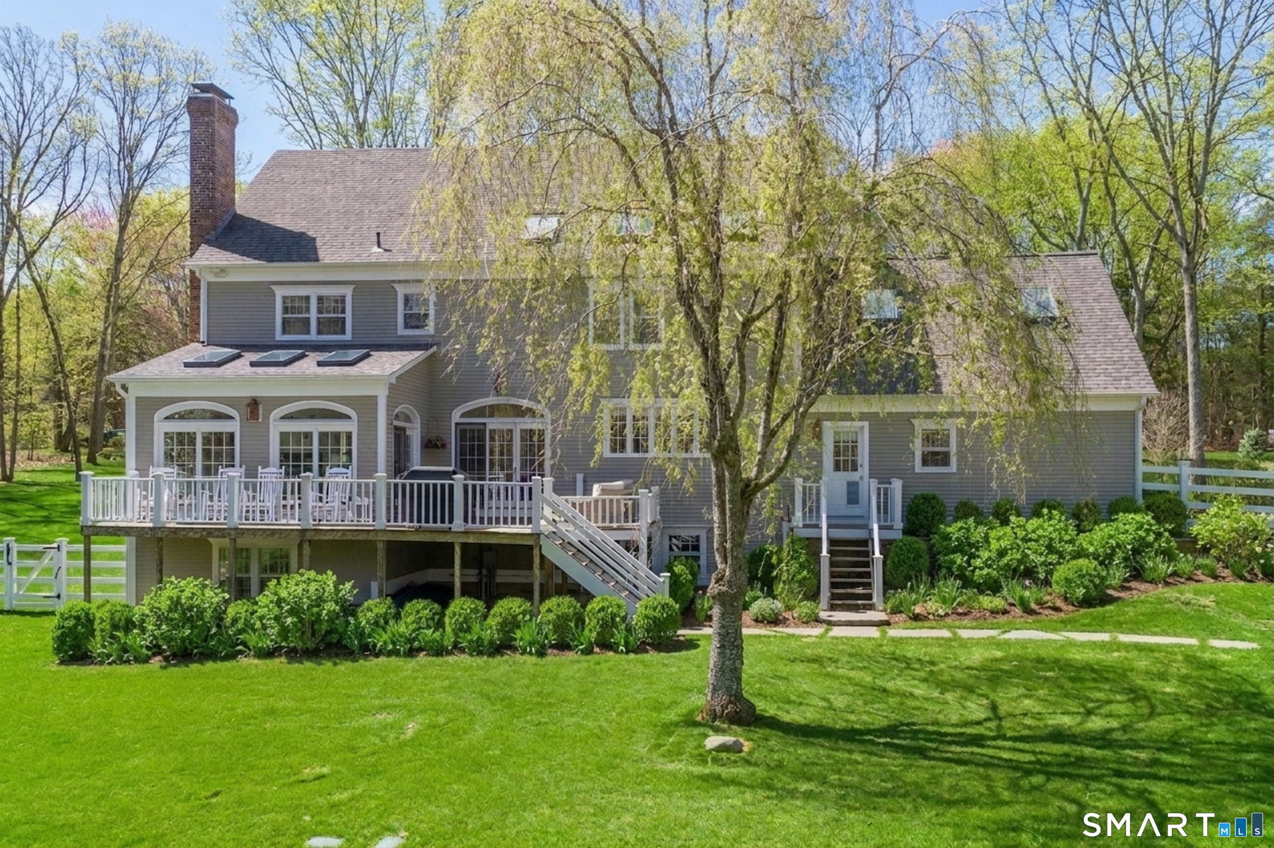 9 Matson Ridge Old Lyme, CT 06371 - Photo 3 of 42 Beautiful upper deck looking over back yard with a walk out finished basement