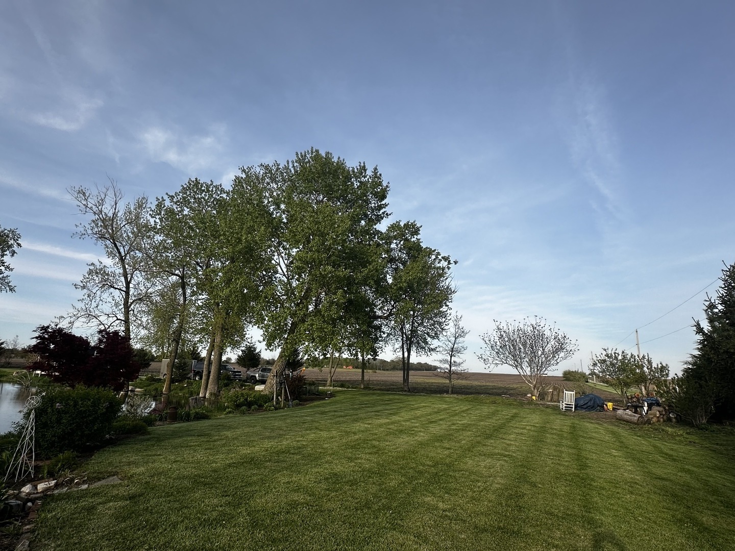 860 East 1100 Road Champaign, IL 61822 - Photo 14 of 60 a big yard with lots of green space and trees