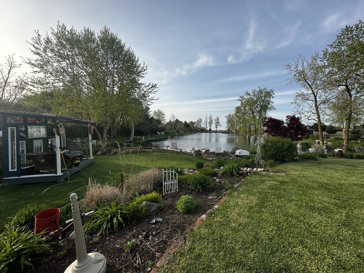 860 East 1100 Road Champaign, IL 61822 - Photo 15 of 60 a view of a garden with plants and large trees
