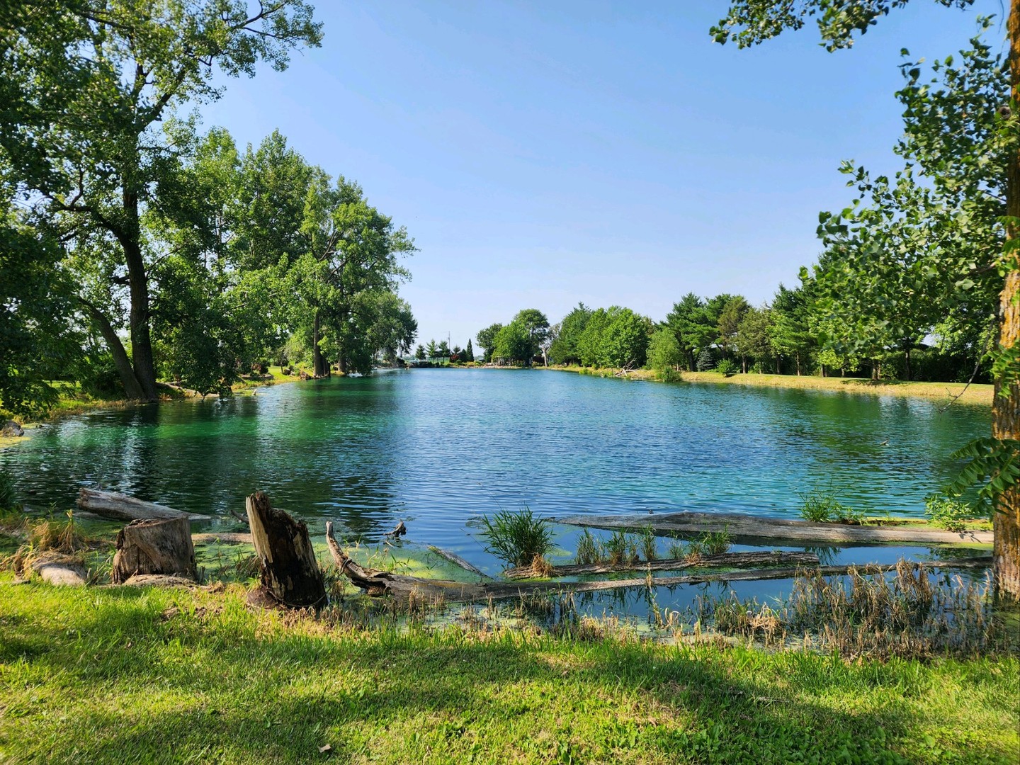 860 East 1100 Road Champaign, IL 61822 - Photo 2 of 60 a view of a lake with a house in the background