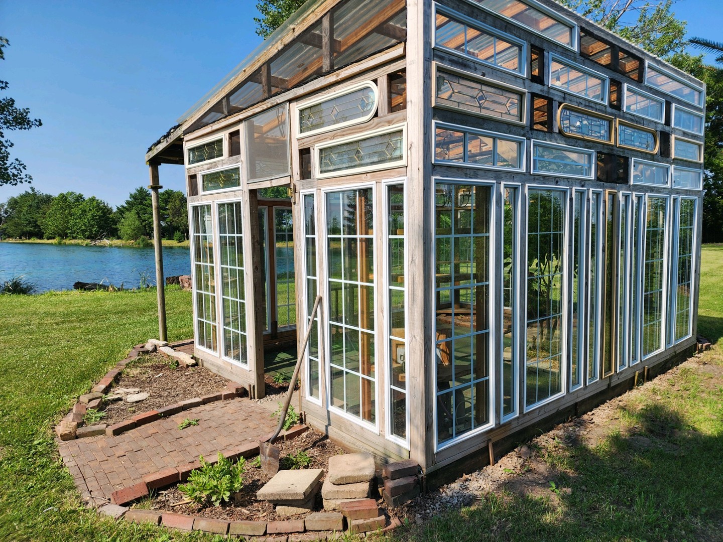 860 East 1100 Road Champaign, IL 61822 - Photo 22 of 60 a view of a building with a garden and pathway