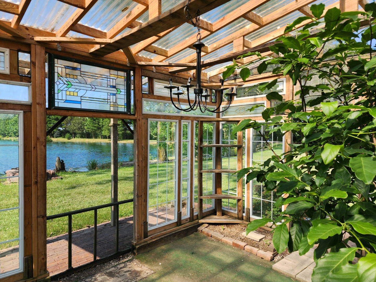860 East 1100 Road Champaign, IL 61822 - Photo 24 of 60 a view of a porch with a small yard