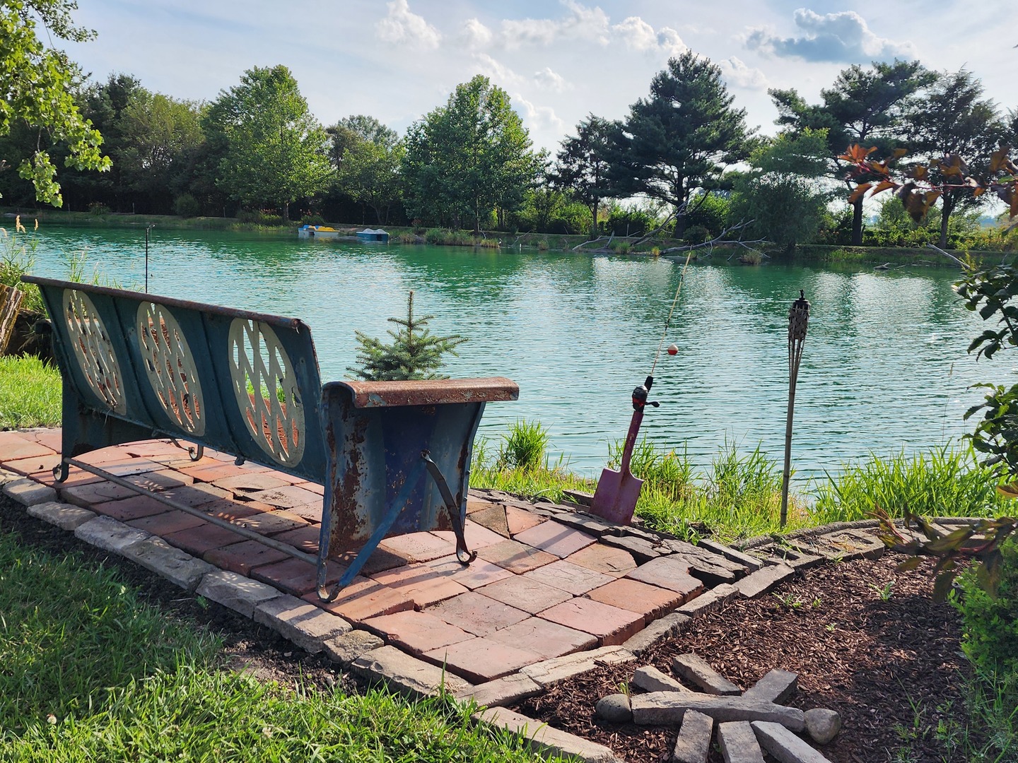 860 East 1100 Road Champaign, IL 61822 - Photo 3 of 60 a view of a wooden deck with lake and bench