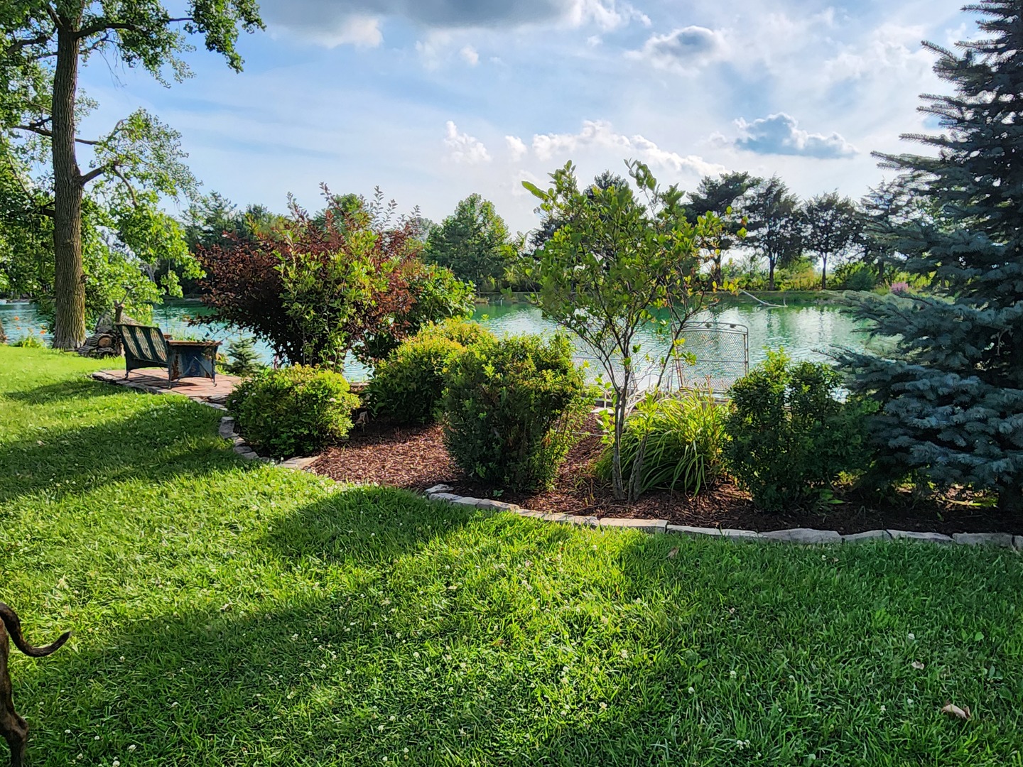 860 East 1100 Road Champaign, IL 61822 - Photo 33 of 60 a view of a garden with a lake