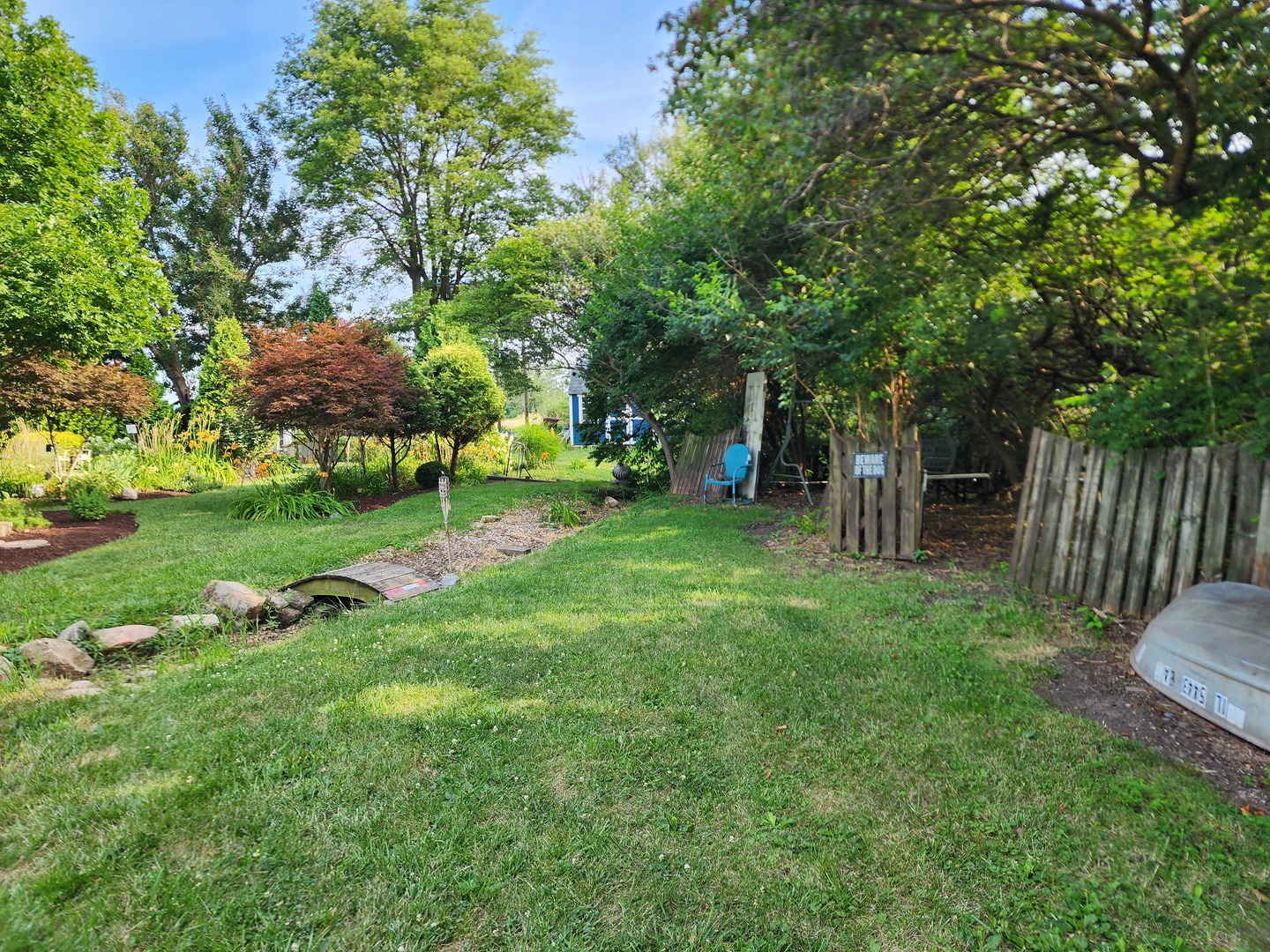 860 East 1100 Road Champaign, IL 61822 - Photo 38 of 60 a view of a wooden deck and bench