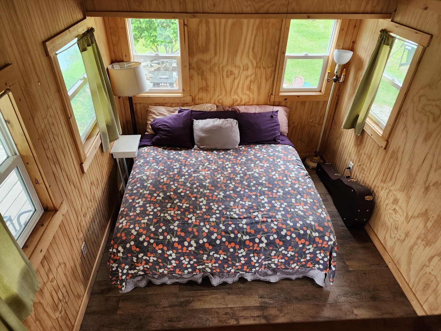 860 East 1100 Road Champaign, IL 61822 - Photo 47 of 60 a bedroom with wooden floor and a large bed