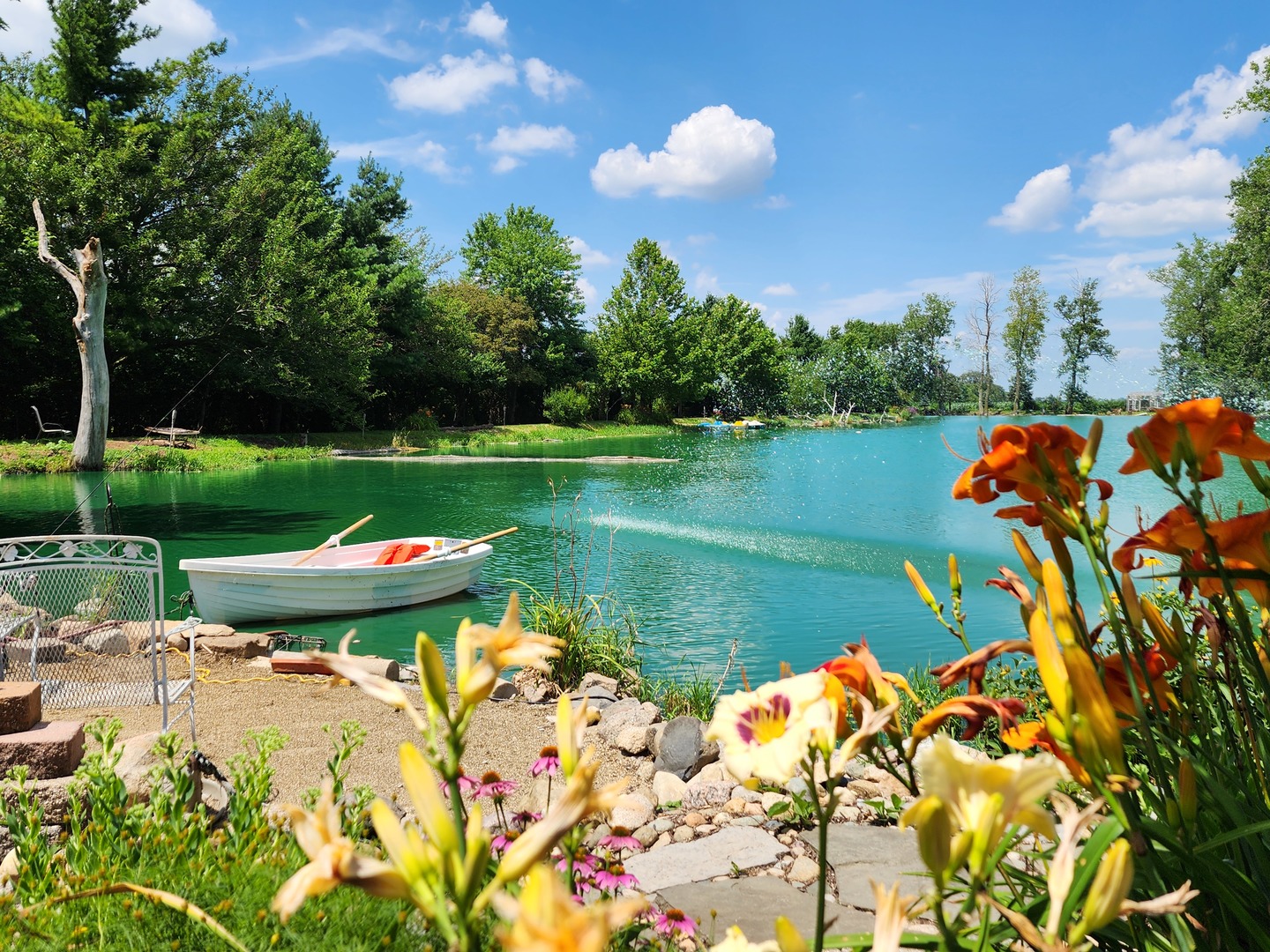 860 East 1100 Road Champaign, IL 61822 - Photo 5 of 60 a view of a lake with a yard and outdoor seating