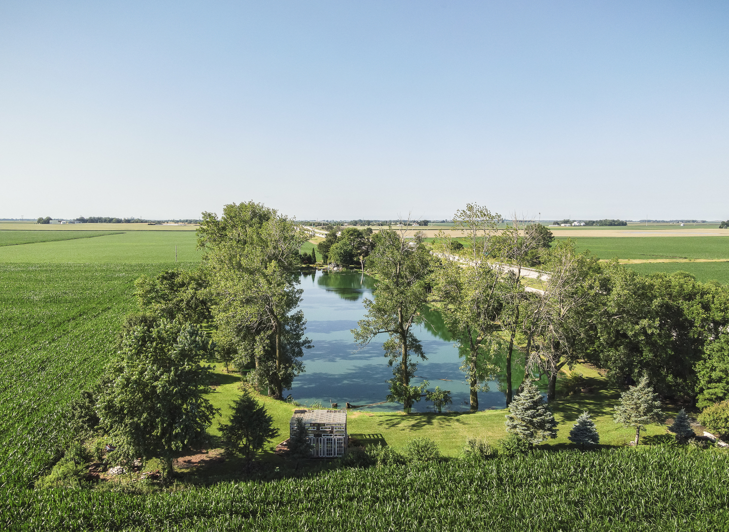 860 East 1100 Road Champaign, IL 61822 - Photo 56 of 60 a view of a lake with a yard
