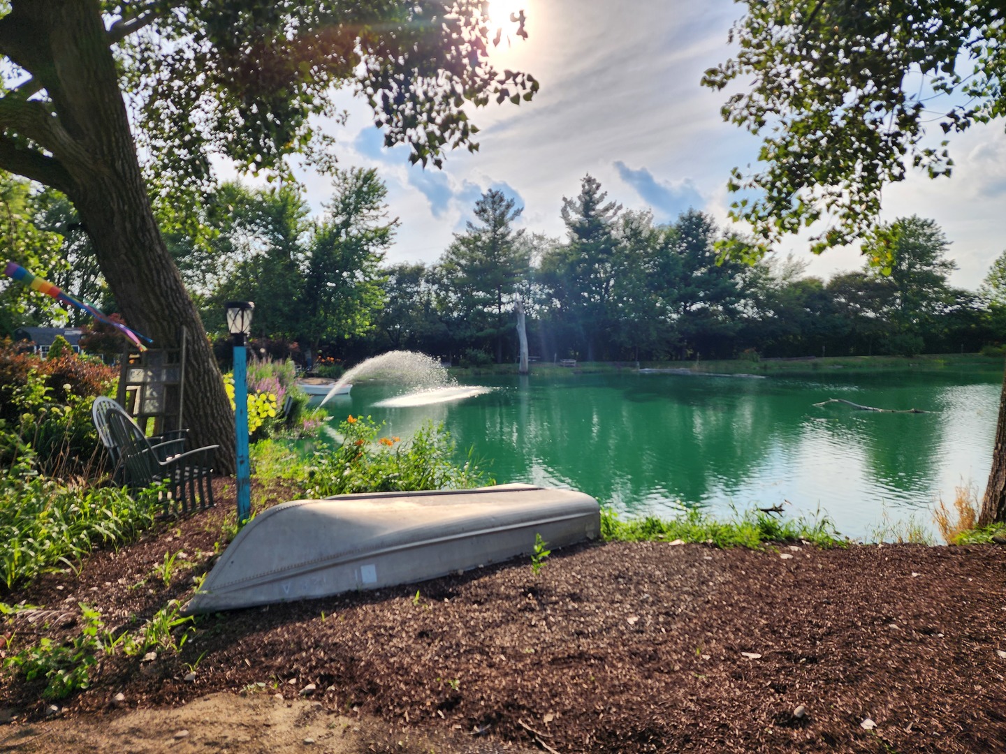 860 East 1100 Road Champaign, IL 61822 - Photo 10 of 60 a garden view with a lake view