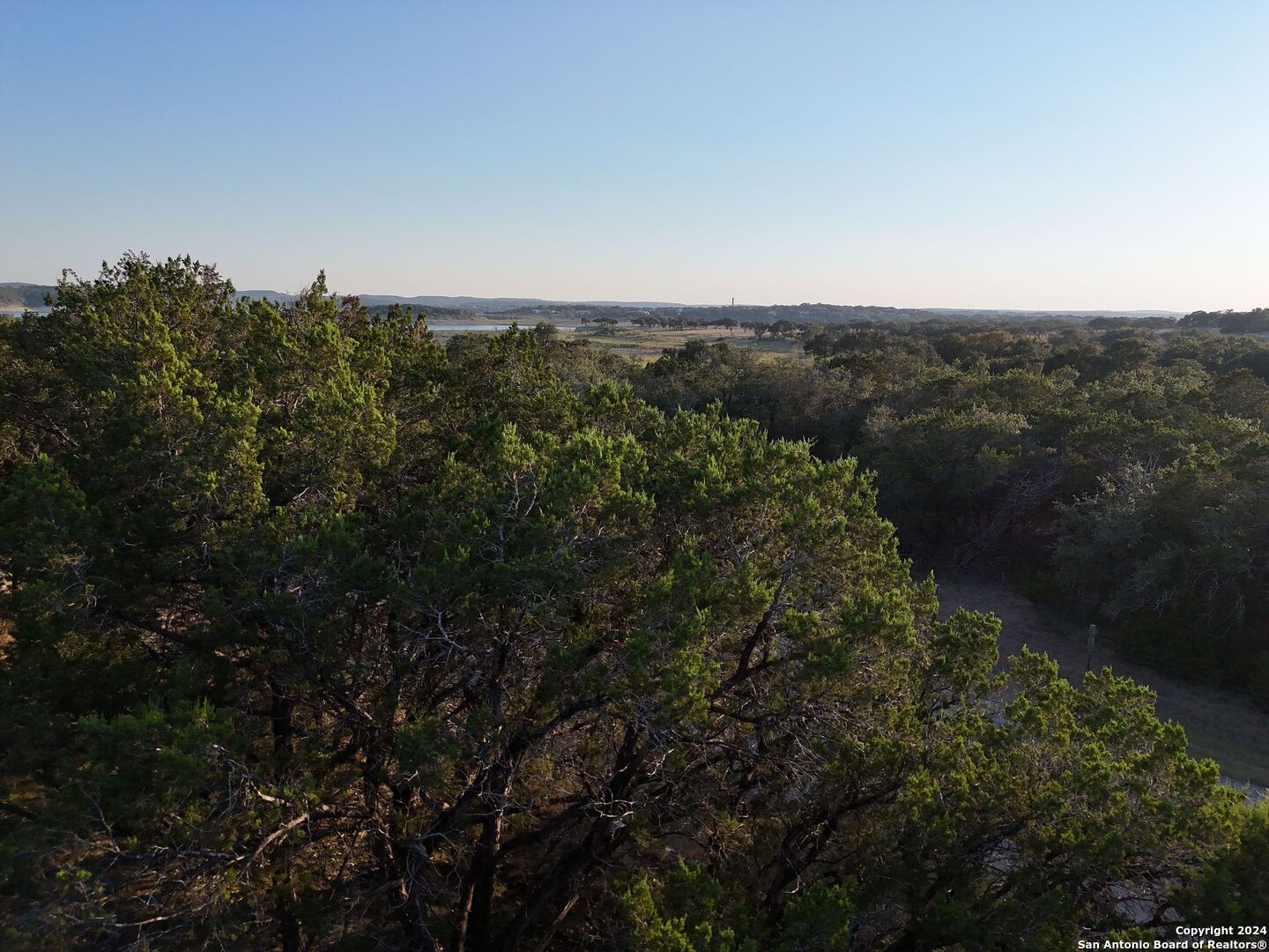 1167 Hancock Road Canyon Lake, TX 78133 - Photo 11 of 29 a view of a city with lush green forest